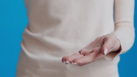 woman applying cream to her hands