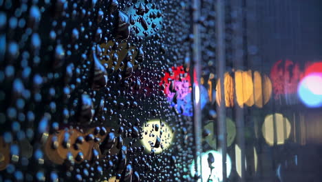 rainy night cityscape view through a window
