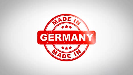 made in germany signed stamping text wooden stamp animation. red ink on clean white paper surface background with green matte background included.