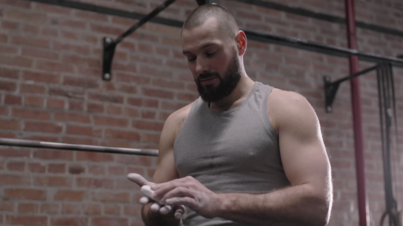 Man Preparing Hand for Lifting Weights