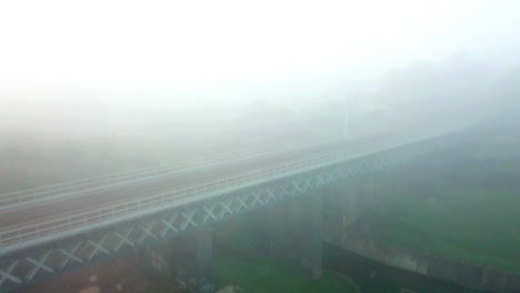 early morning foggy mist railway bridge - arches