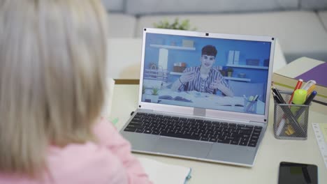 University-student-girl-studying-online-lesson-with-her-friend.