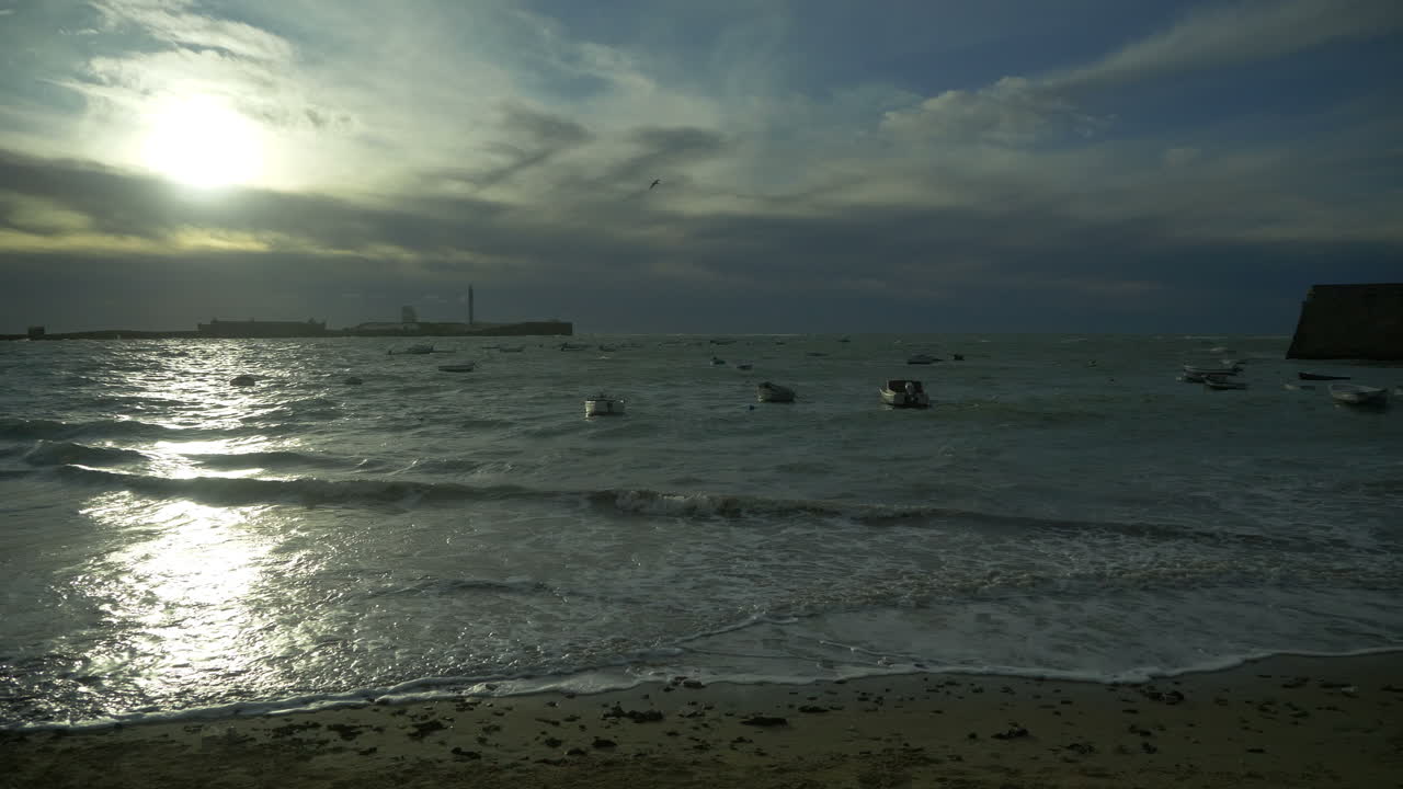 Ominous Storm Clouds Gathering over Pier, Beach and Marina, December, Cadiz, Spain