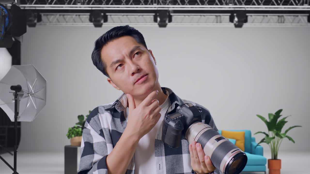 Photographer in Studio Thinking/Happy