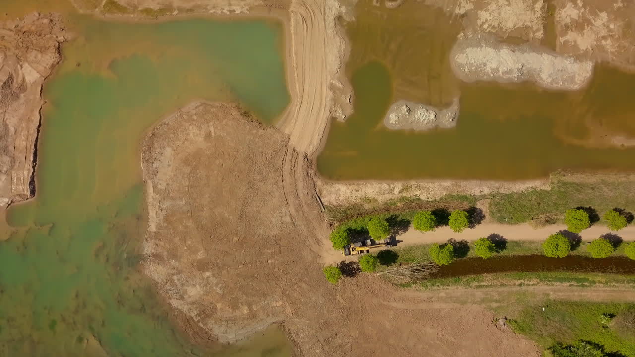Aerial drone shot of the bird-eye views at the sand mining site in the Netherlands, Europe.