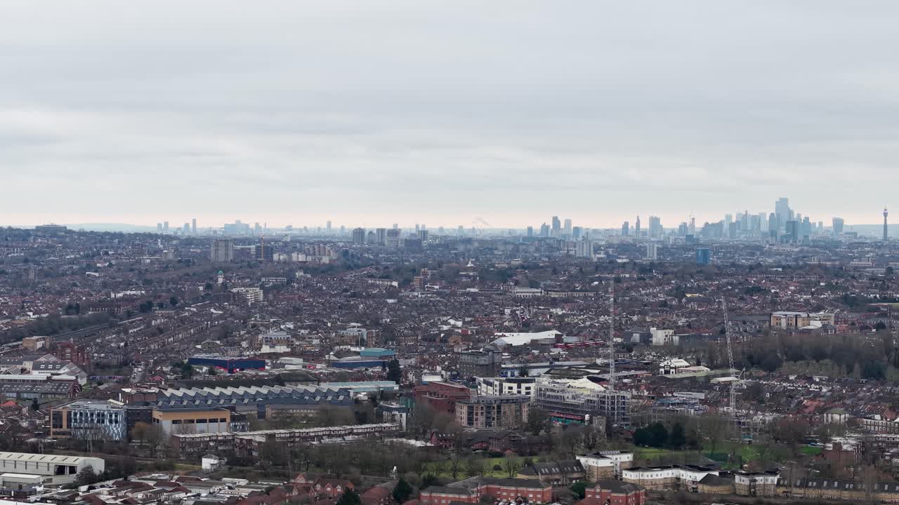 Aerial View Of Wembley With City Skyline In Fog In Distance. London Borough Of Brent, England. sideways shot