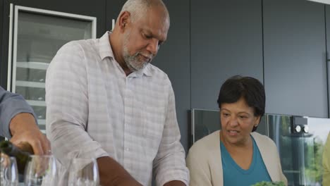 Happy-senior-diverse-people-cooking-in-kitchen-at-retirement-home