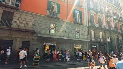 crowded alley with shops and street activity