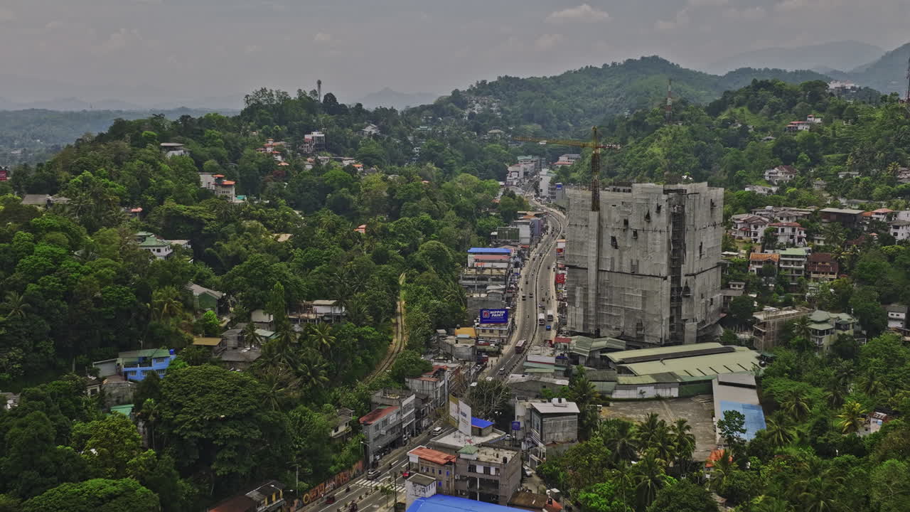 Kandy Sri Lanka Aerial v5 drone flyover along A9 Katugastota road across Wattarantenna suburbs capturing road traffics and Nittawela hillside landscape views - Shot with Mavic 3 Cine - April 2023