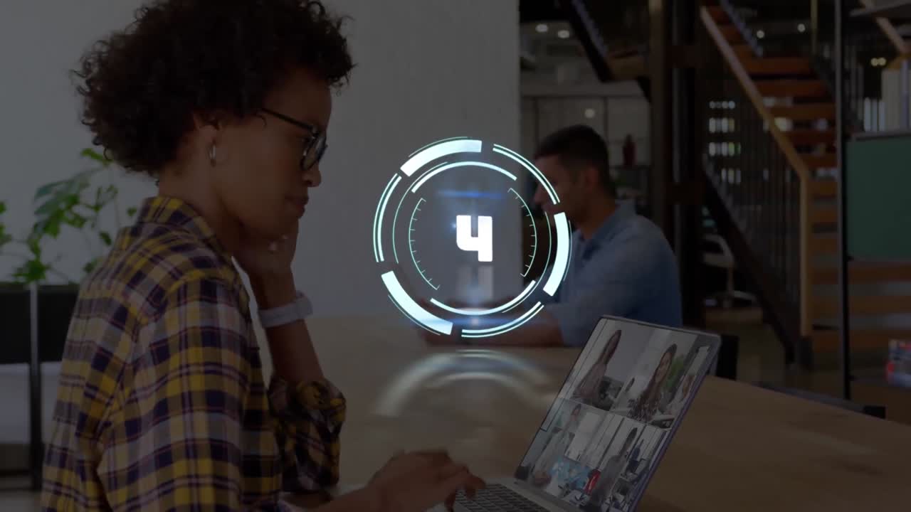 Animation of scope scanning with countdown over woman on laptop video call