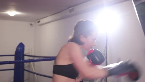 female boxer in sparring amateur boxing selfdefense girl boxer practices punches professional womens boxing
