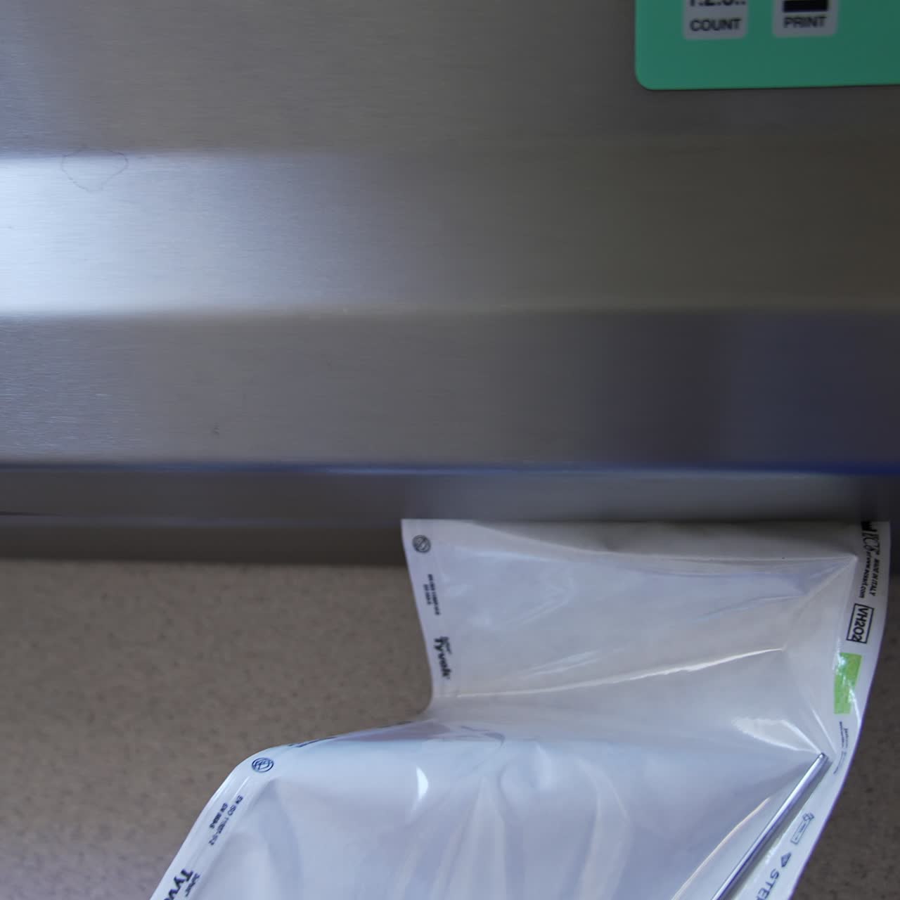 Vacuum packaging machine for sealing the bag with medical tool. Preparation of instruments for sterilization in the equipment