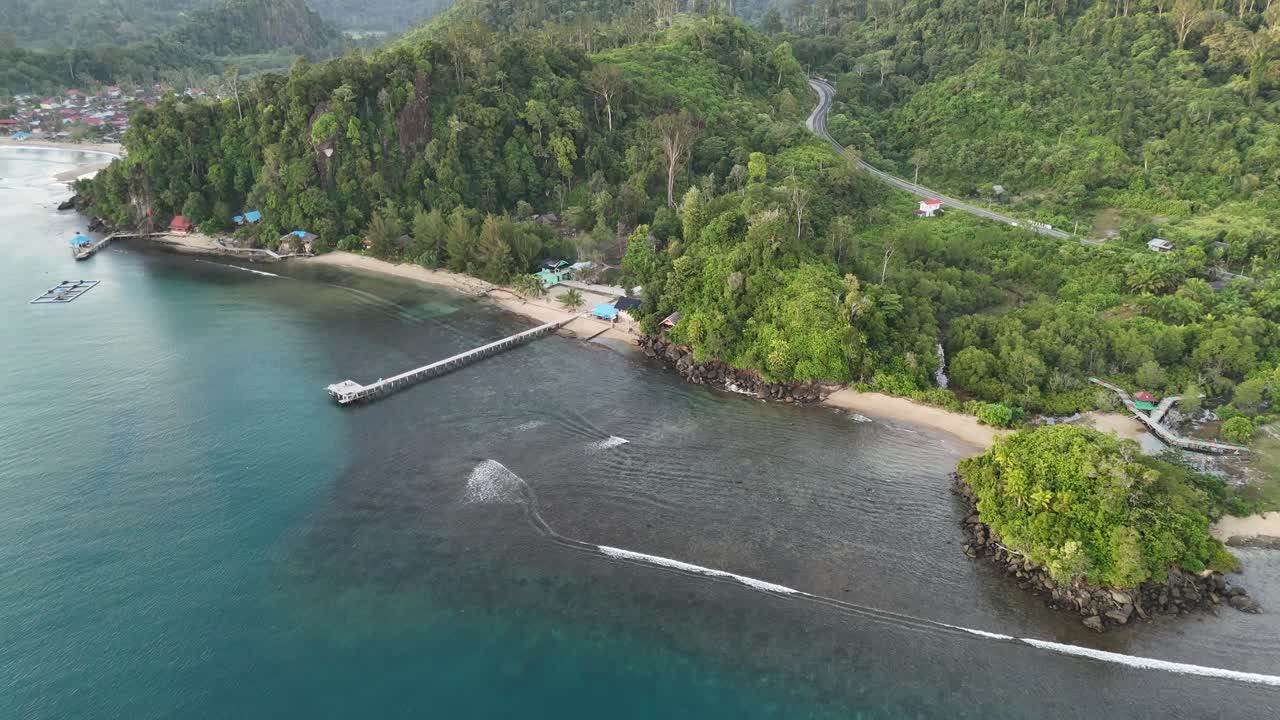 Drone aerial view of indonesian coastline padang west sumatra tropical ocean rainforest jungle trees