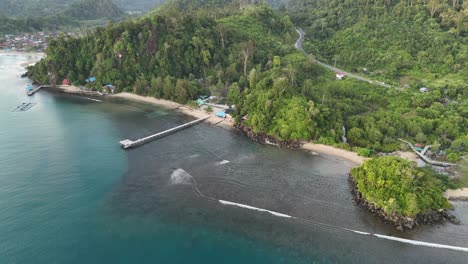 drone aerial view of indonesian coastline padang west sumatra tropical ocean rainforest jungle trees