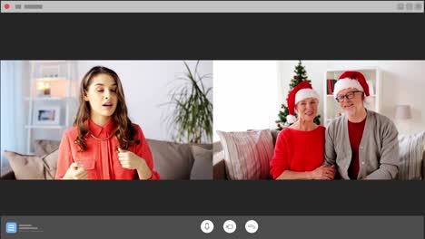 Mujer-Haciendo-Una-Videollamada-Con-Su-Familia-En-Navidad.-Concepto-De-Navidad,-Tecnología-Y-Vacaciones.-Mujer-Joven-Feliz-Haciendo-Una-Videollamada-Con-Una-Pareja-Mayor-En-Messenger.