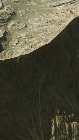 aerial view of a mountain range with a cliff