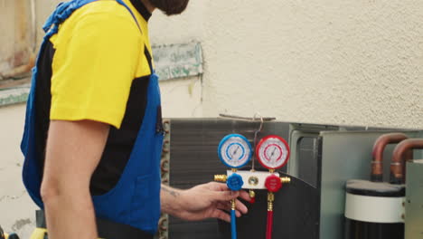 serviceman working on air conditioner