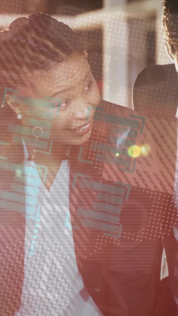 Vertical video: Team leaning over docs in business, HUD dots moving over faces, woman starting talk