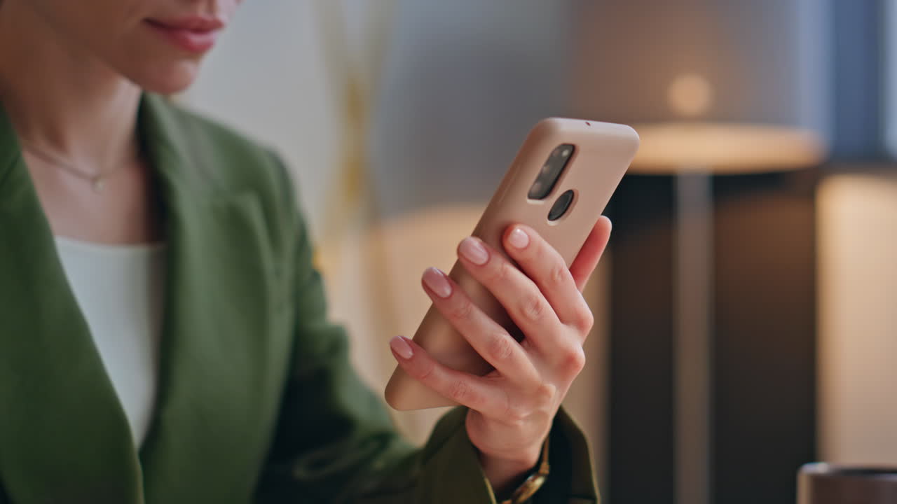 Woman hands scrolling mobile phone sitting office closeup. Lady swiping screen