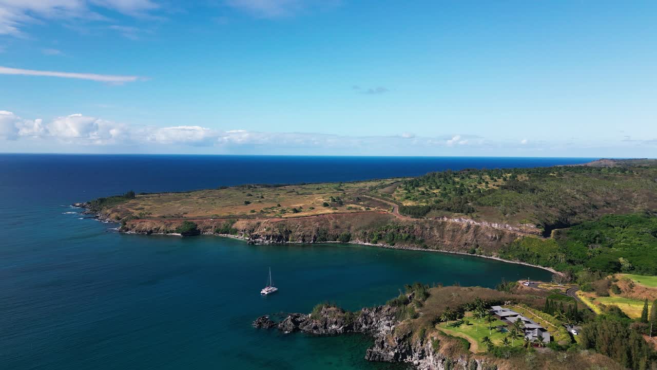 Aerial View of a Tropical Coastline with a Bay and Boat