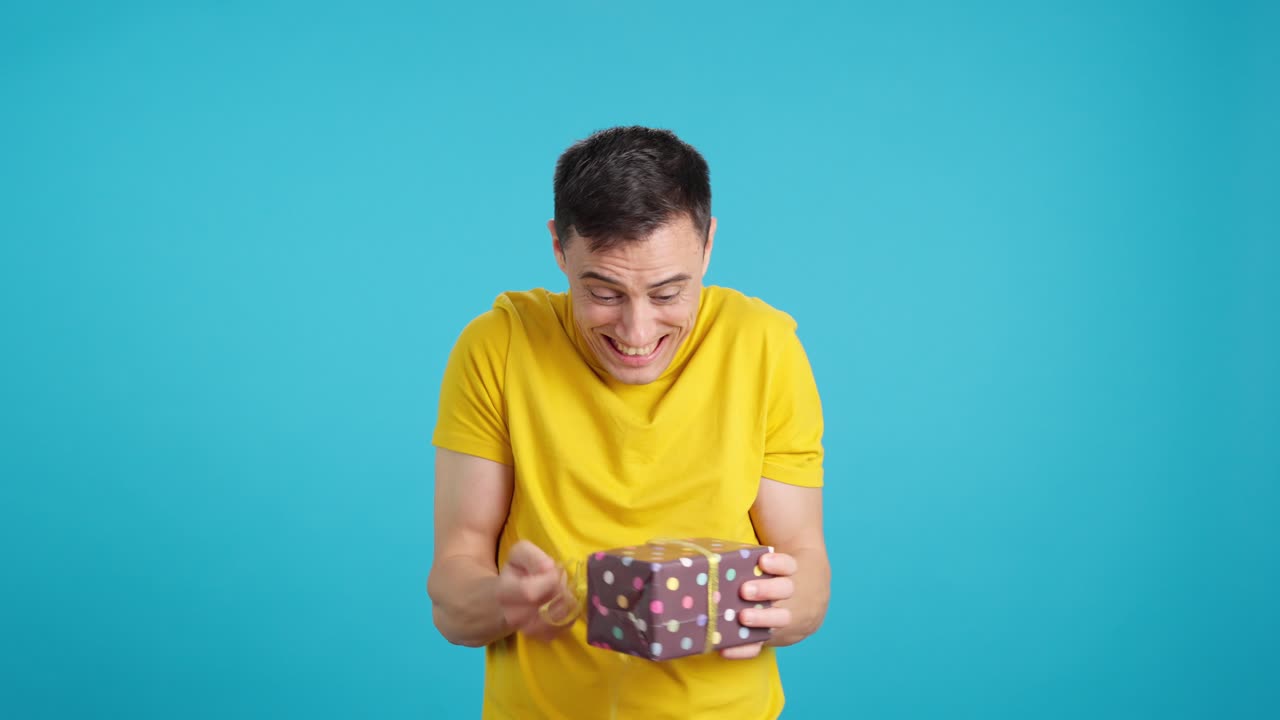 Man opening a gift box with excitement