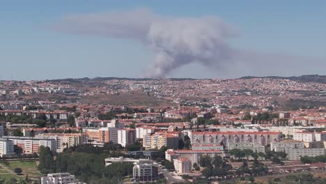 shot  of the lisbon city fire event from a distance. visible clouds of smoke