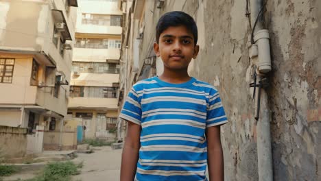 confident young boy standing in a narrow street of a low income neighborhood, embodying the resilience and challenges faced by children in developing communities