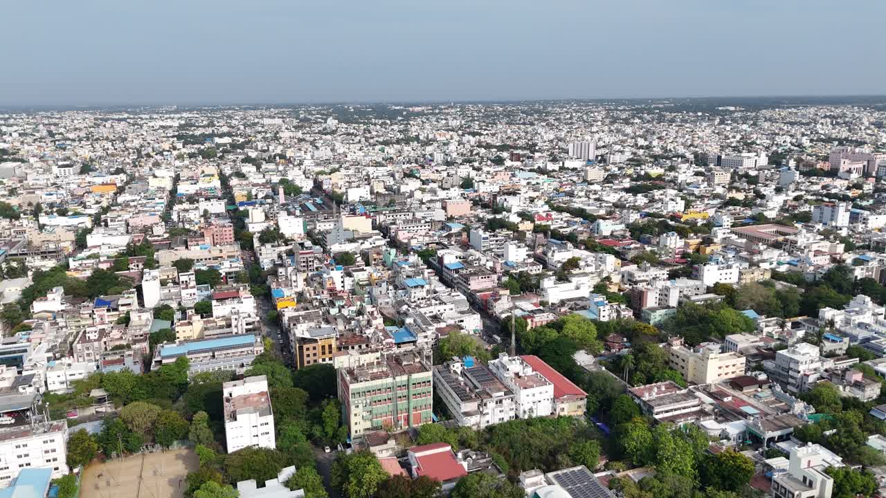 The aerial view scene conveys the immense scale and density of a bustling metropolis, suitable for themes of urban life, population growth, and city planning. The lighting is bright and even