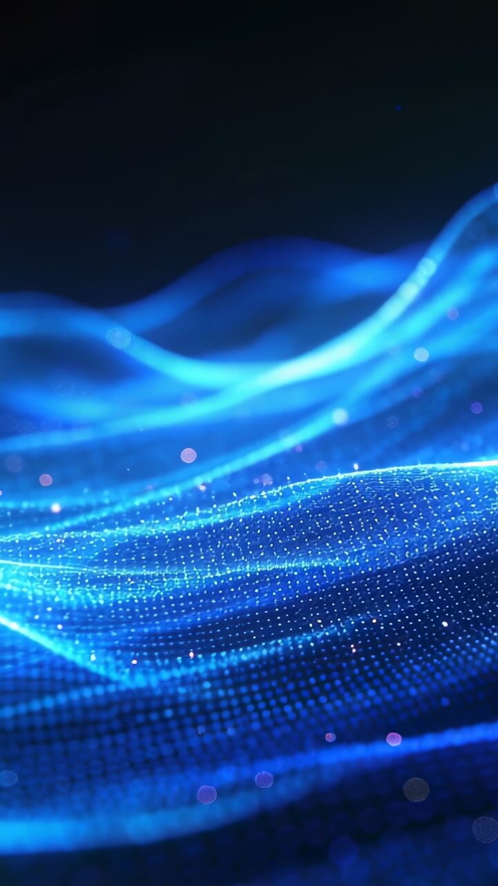 Vertical video: On playback dotted blue mesh forming rippling wave, sparkling and showing tech data