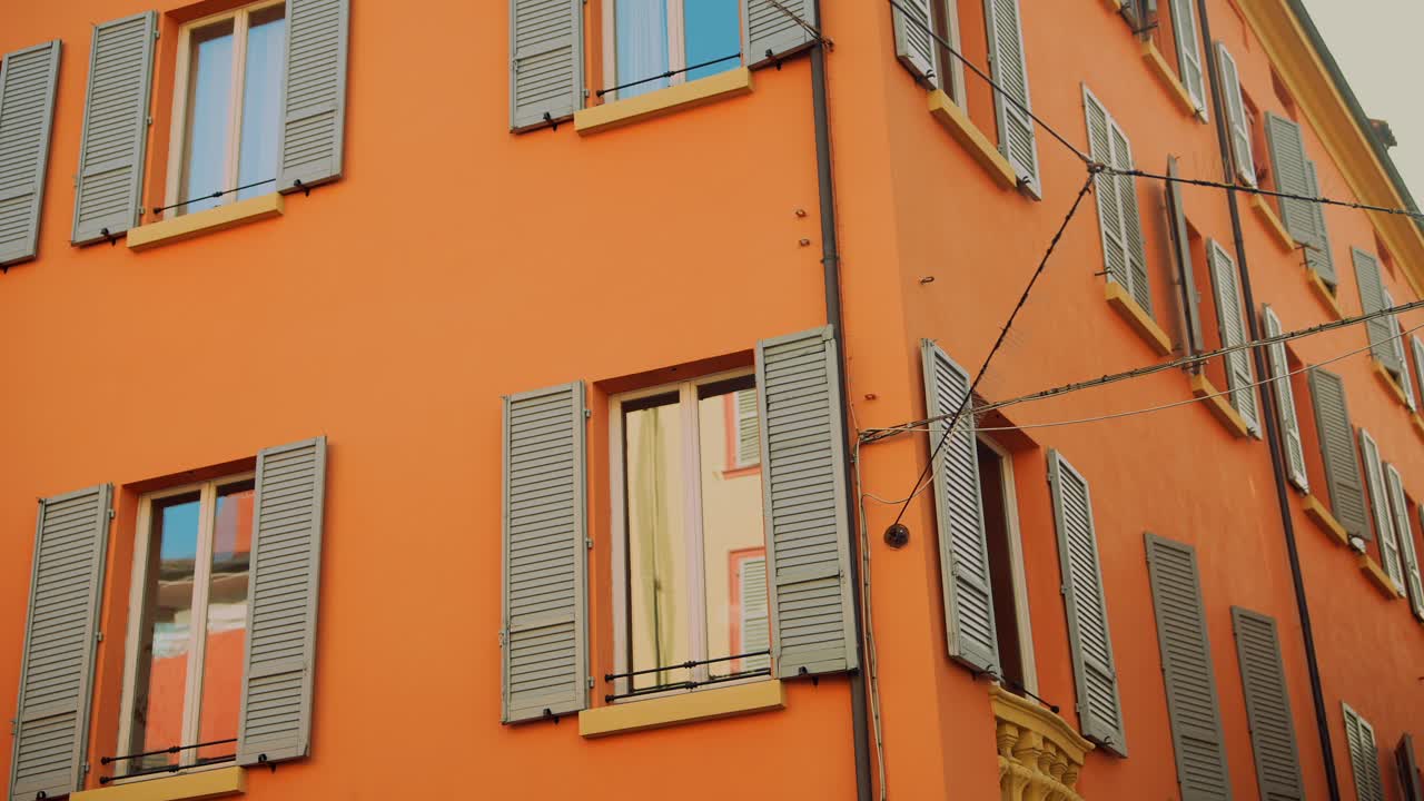Orange Building with Gray Shutters