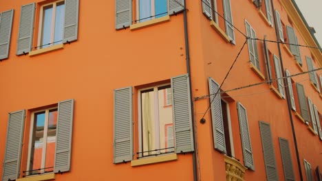 orange building with gray shutters