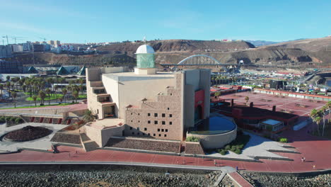 aerial journey over alfredo kraus auditorium in las palmas de gran canaria on a bright day.