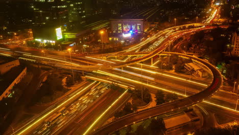 Drone-footage-of-the-metropolis,-Flight-Over-Urban-Traffic-Cars-Lights-Moving-Highway-Busy-City-Transport-Modern-Business-District