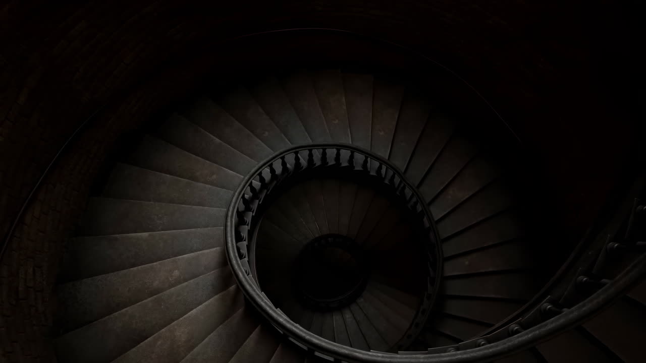 Vista astratta di una scala a chiocciola scura che ruota verso il basso