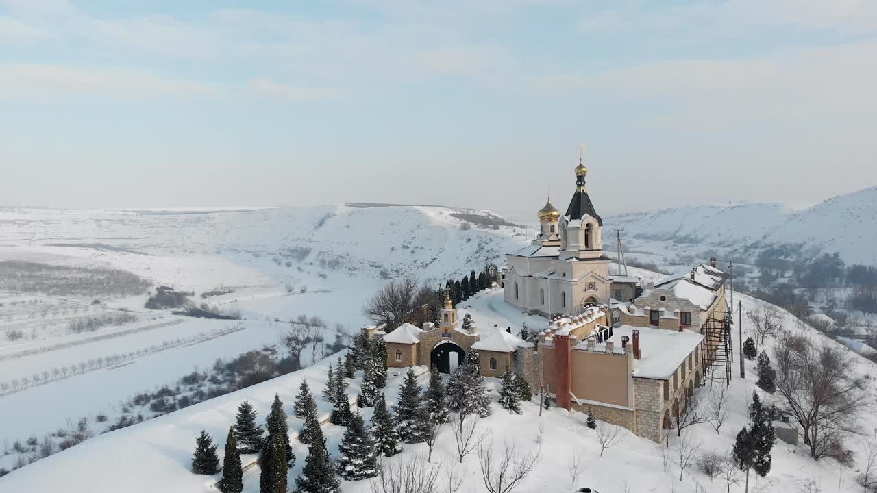 Winter Monastery on a Snowy Hill
