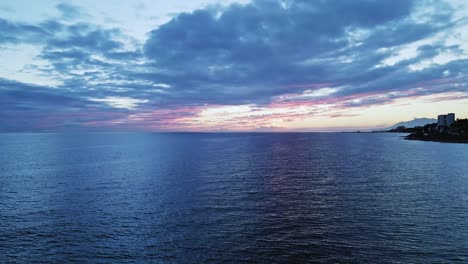 dramatic aerial view of cloudy horizon with slow pedestal up