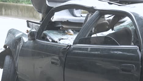 black car damaged by a road accident