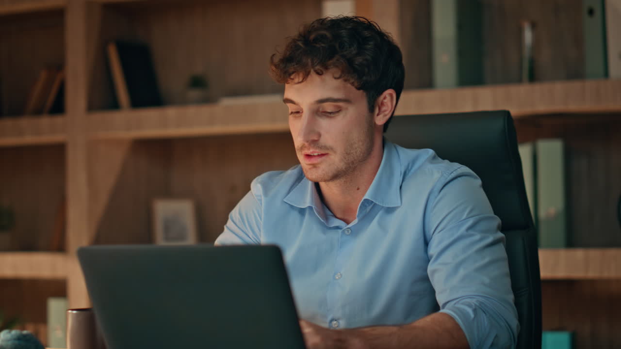 Successful programmer closing laptop satisfied online project late home close up