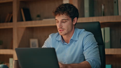 successful programmer closing laptop satisfied online project late home close up