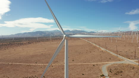 medium shot of windmill, camera moves right to left