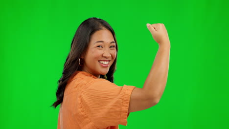 Face, woman and flex arm on green screen in studio