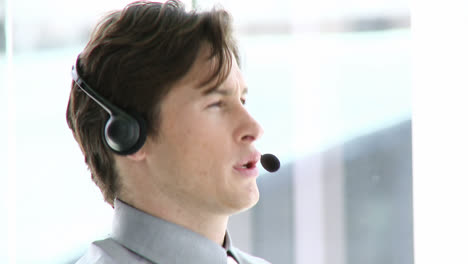 charming businessman working in a call center