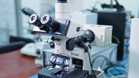 optical microscope - science and laboratory equipment. automated scientific laboratory microscope for research in medical development clinical laboratory. close up.