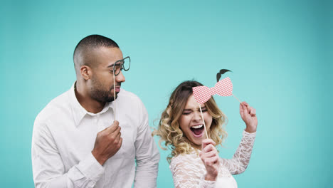 Attractive-mixed-race-couple-dancing-slow-motion-party-photo-booth