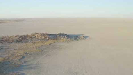 drone shot of unique and empty wild tourism attraction on kubu island, makgadigadi pans botswana