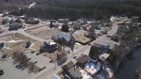 aerial fly above little french canadian village of saint-côme in the lanaudière region of quebec