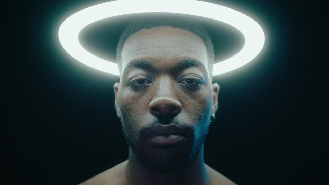 Black Confident Man Posing under Ring Light