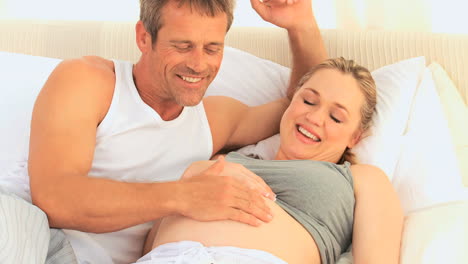 future parents feeling their future baby