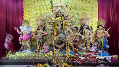 wide shot of a huge sized goddess durga sculptor in kolkata.