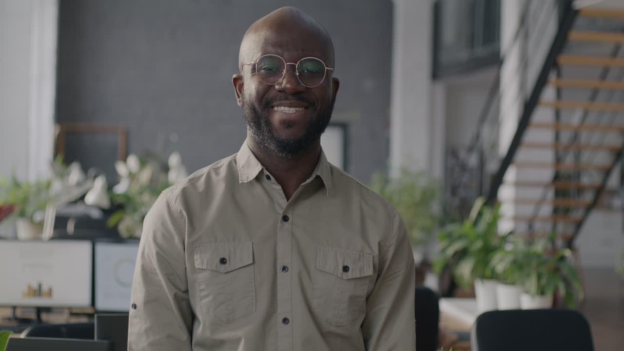 Smiling African American Business Man in Modern Office